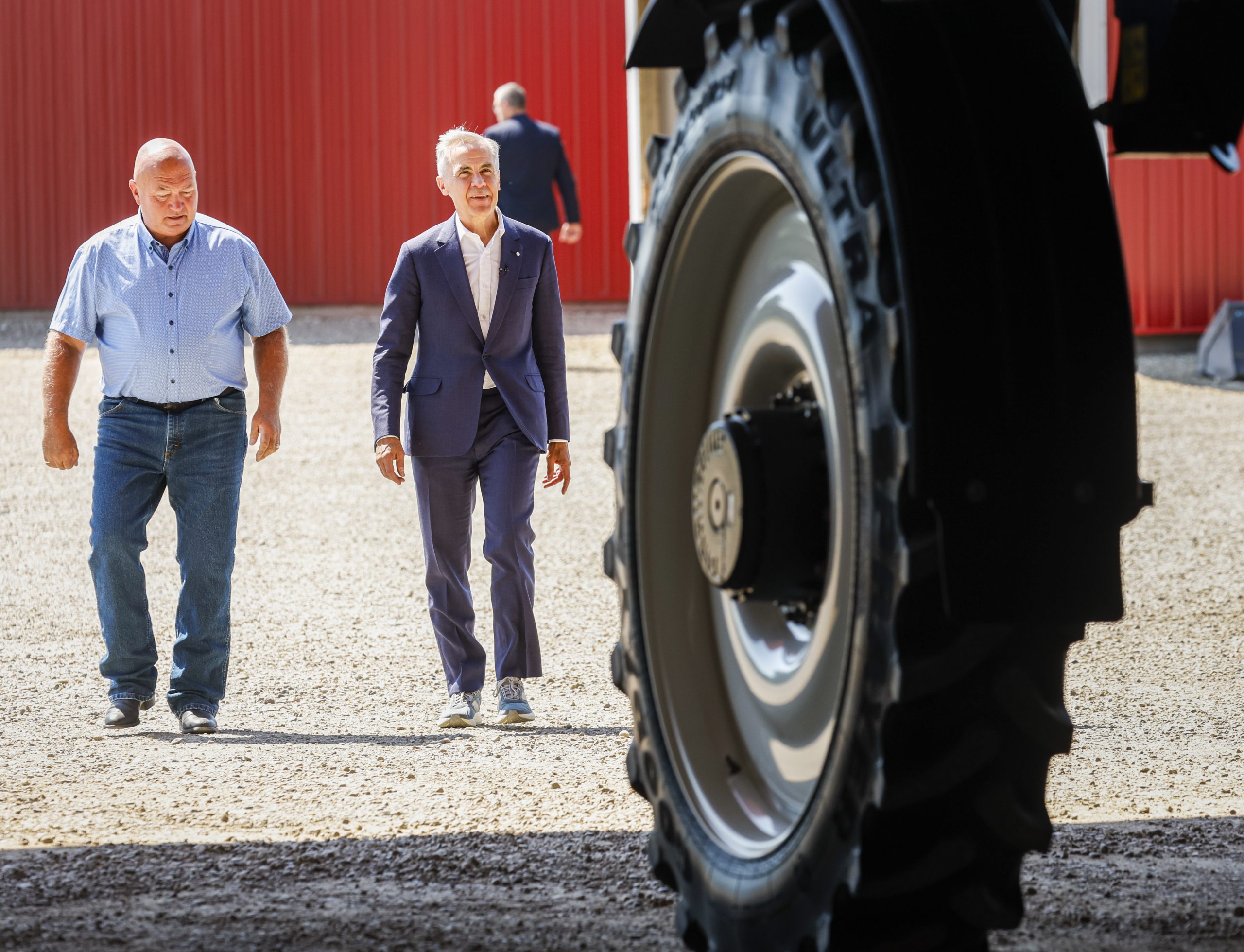 Carney comes to Alberta, talks housing, rides a sprayer, hears from separatists