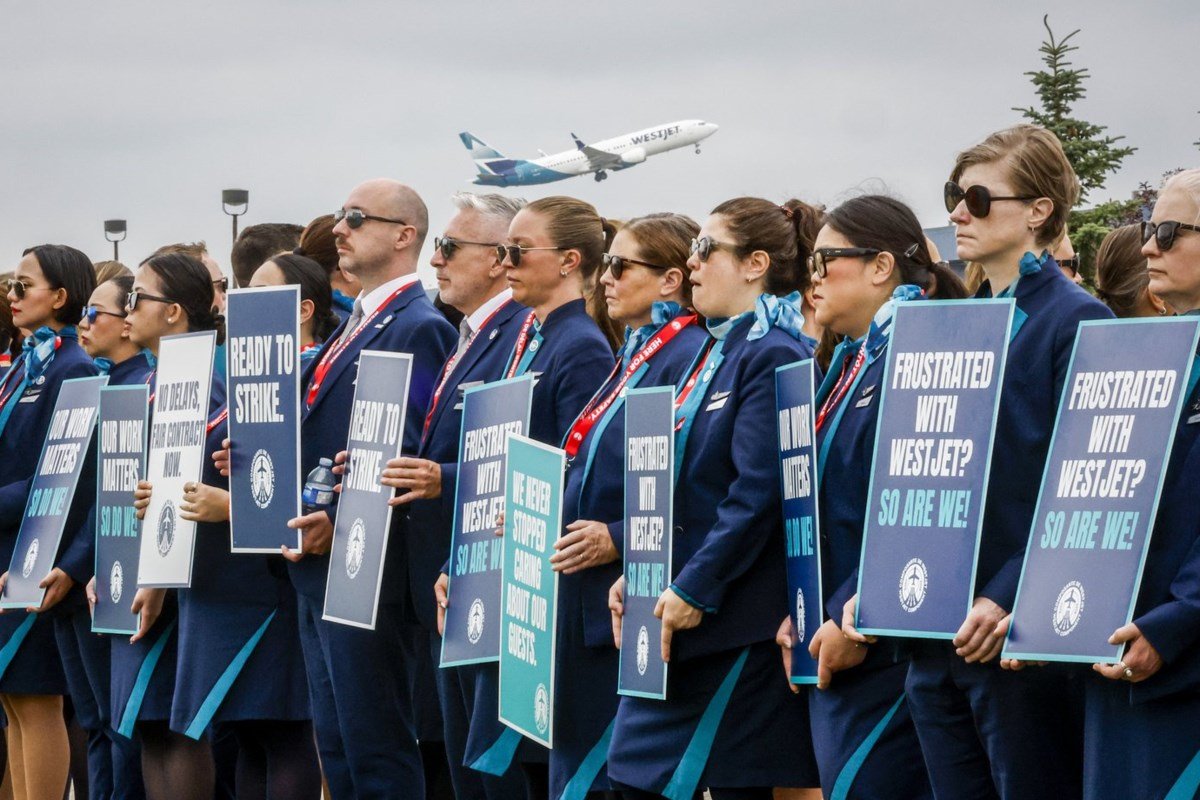 WestJet flight attendants approve strike mandate as ground pay takes centre stage