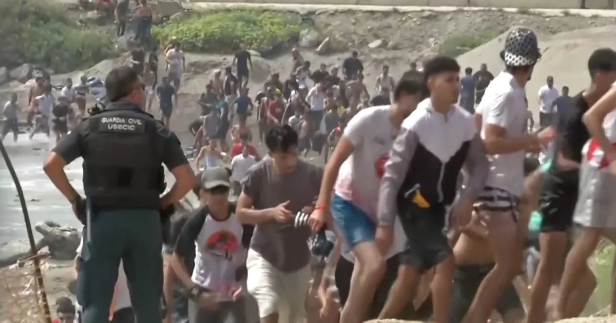Thousands of migrants force their way into Spain’s Ceuta territory in North Africa