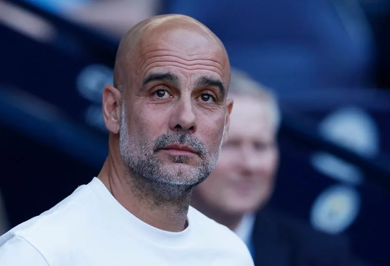 Soccer-Guardiola’s office contents, including coffee cups and ceramic turtles, up for auction