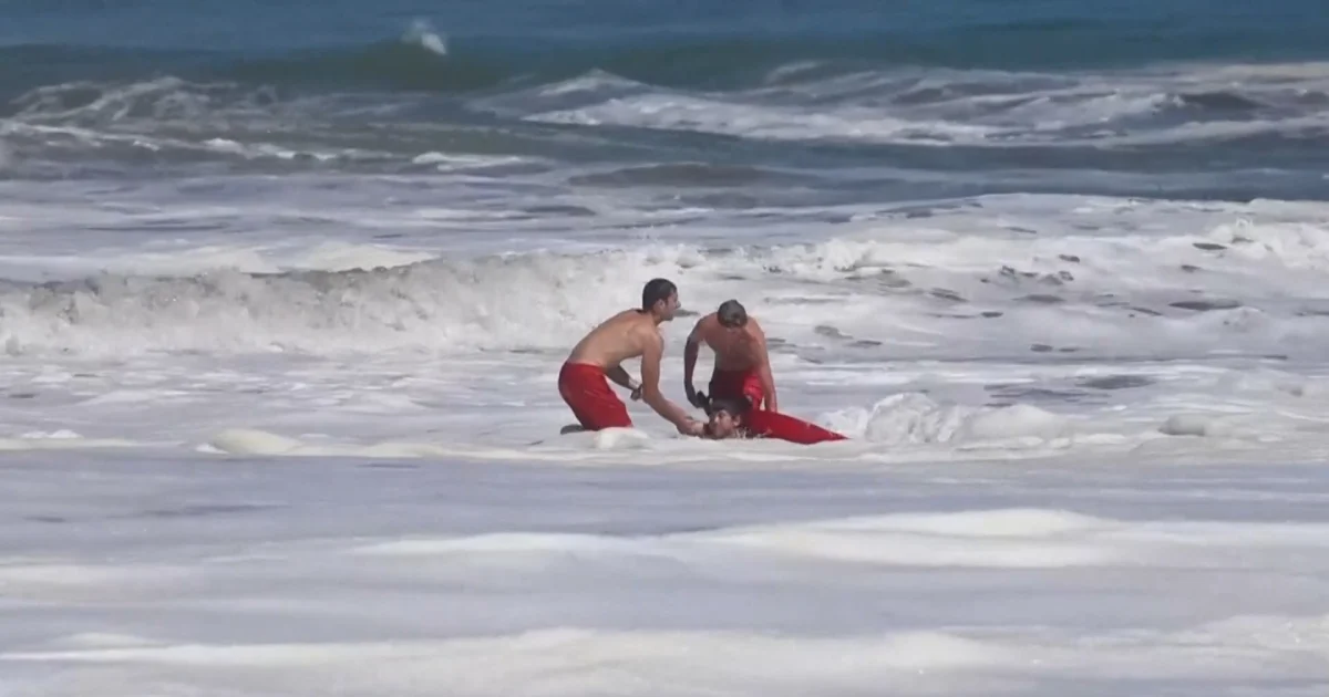 Dramatic video shows a 10-year-old boy rescued from pounding waves