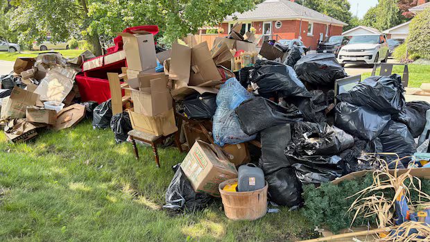 93-year-old’s ‘lifetime of memories’ piled on a curb in St. Catharines, Ont., after flooding