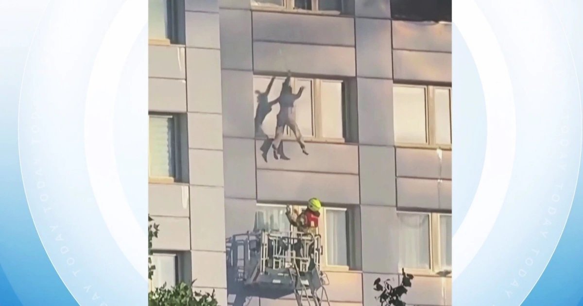 Woman Falls Into Firetruck Rescue Basket to Escape Building Fire