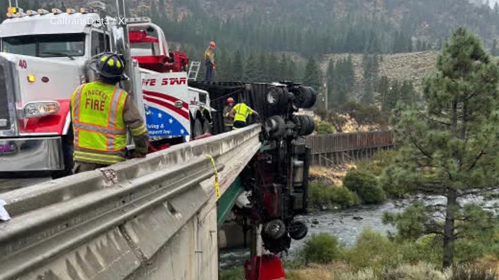 WATCH:  18-wheeler outside California's Lake Tahoe left dangling from overpass after crash