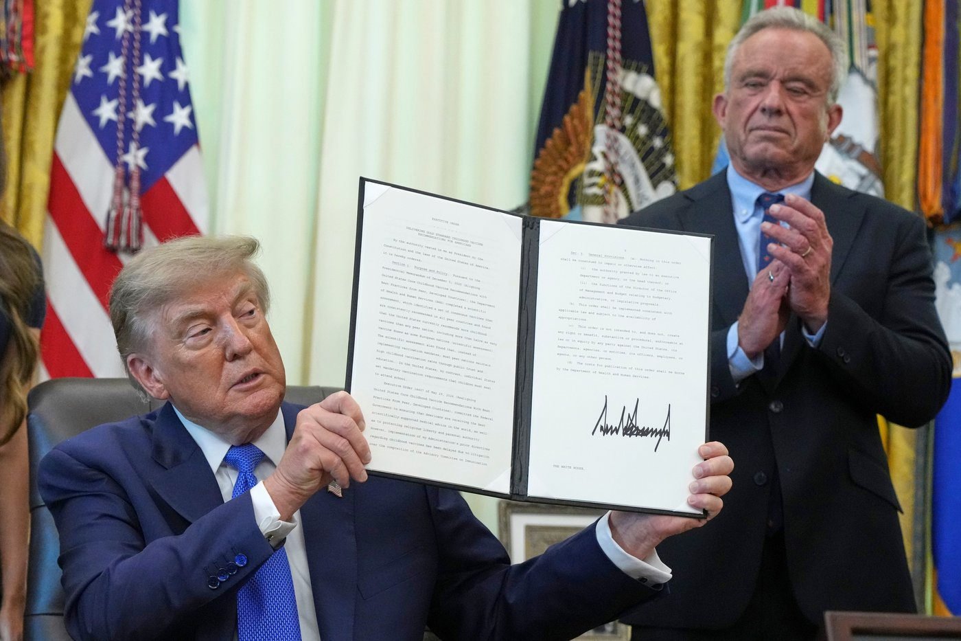 FACT FOCUS: Trump makes false claims as he signs order urging revisions around childhood vaccines