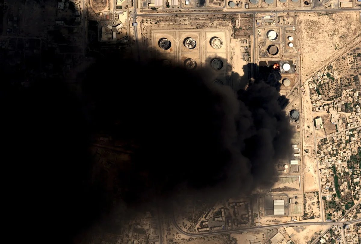 Drone strikes hit Libya’s key western oil town and a car bomb kills an officer in the east