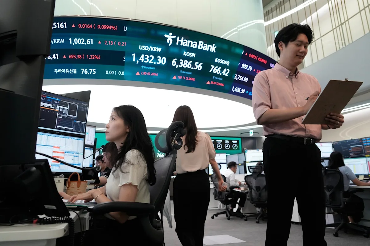 Oil prices gain and Asian shares are mixed after a rally on Wall Street