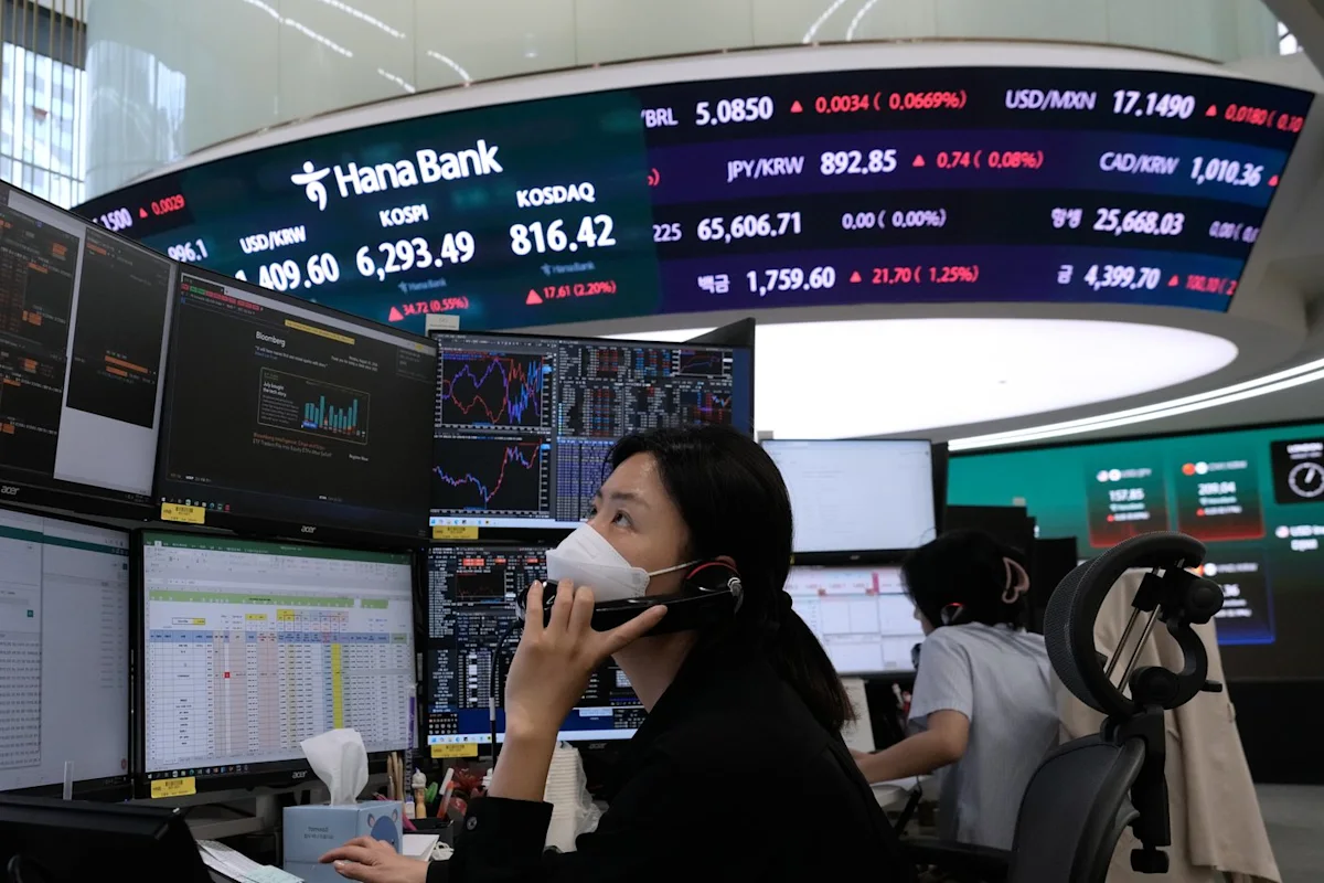 Asian shares are mixed after gains on Wall Street, while oil prices climb
