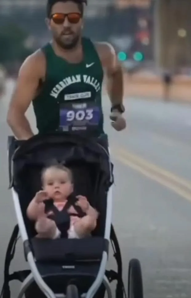 Watch: Dad unofficially breaks world record for running a mile with stroller
