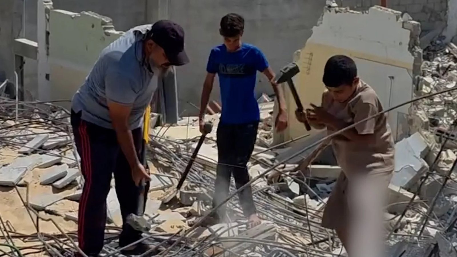 Father and sons forced to manually clear rubble in Gaza | Israel-Palestine conflict News