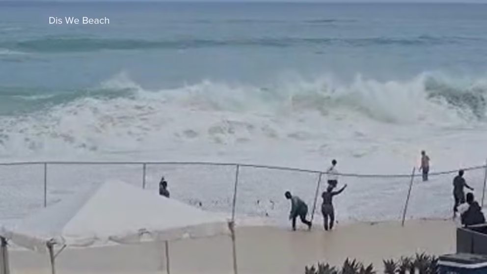WATCH: Video shows woman's terrifying rescue from rough surf in the Bahamas