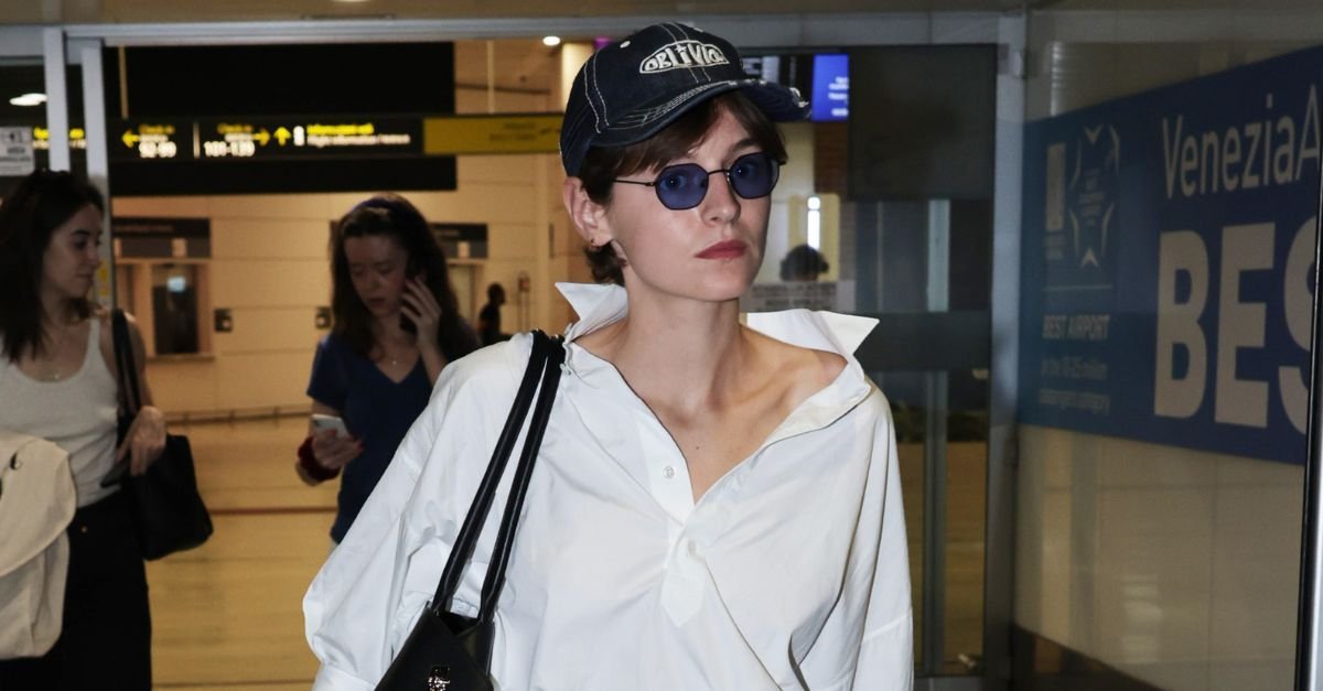Emma Corrin Arrived at the Airport In the Smartest Flat Shoe Trend