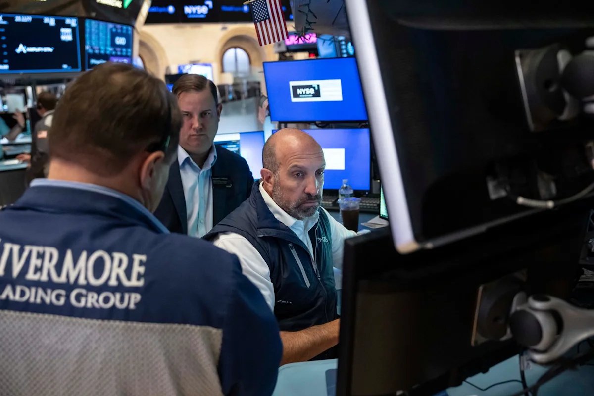 Stocks fall after a surprisingly strong jobs report raises prospects of an interest rate hike
