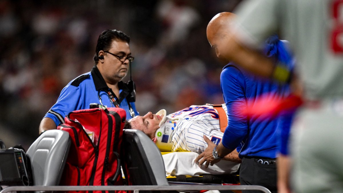 Mets’ Jared Young carted off field after colliding with Nolan McLean during play at first base