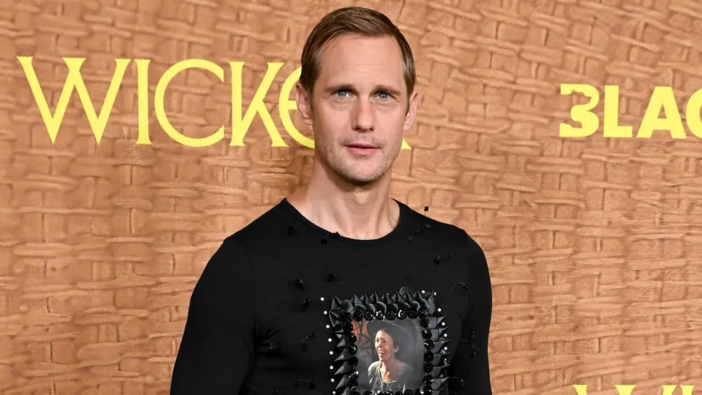 Alexander Skarsgard Wears Olivia Colman’s Face and A Plaid Skirt in LA